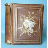 A Victorian album of cartes de visite with musical movement.