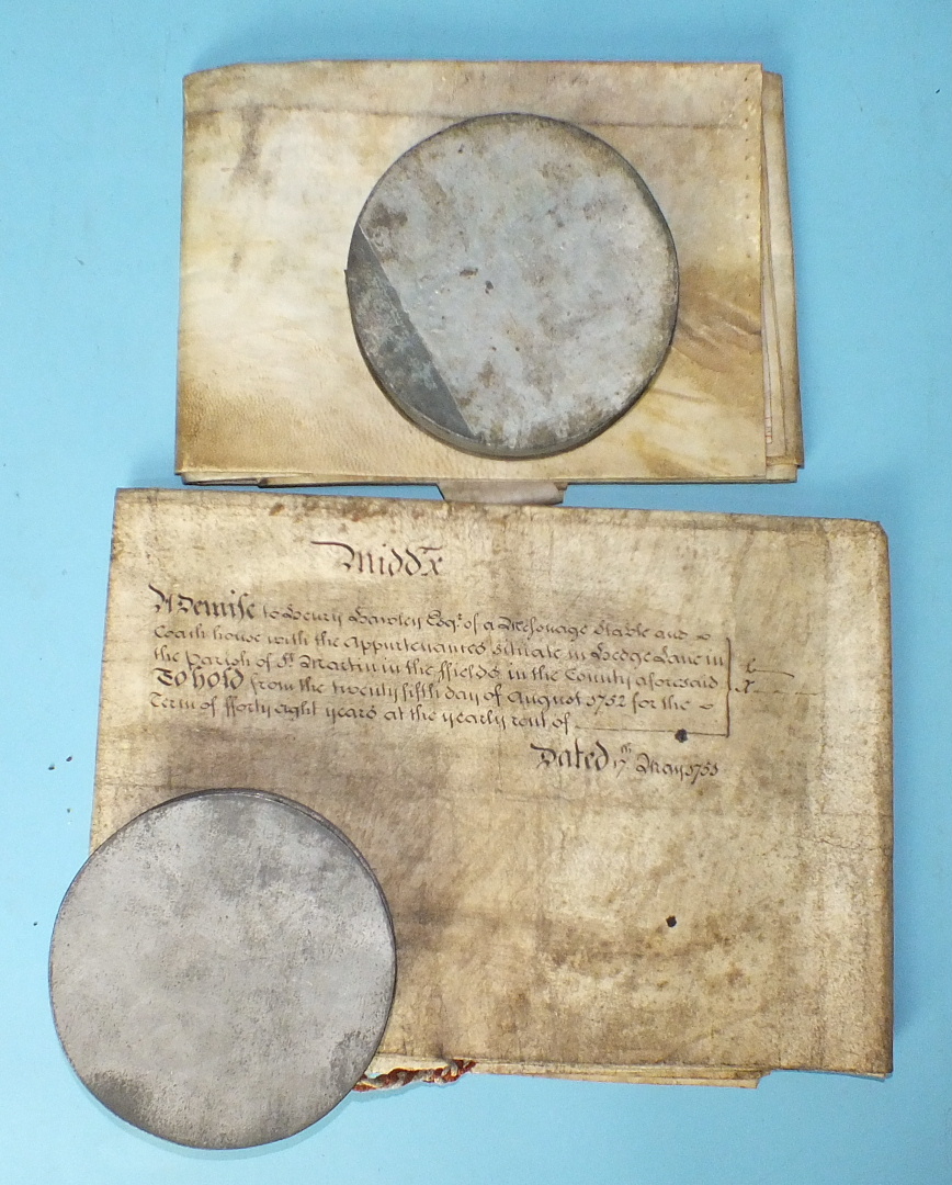 A William III recovery document, vellum, with remains of a seal in tin case and a George II vellum