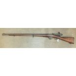 A Torre Annunziata 1889 10.5mm bolt-action rifle with full wood stock and rammer, 135cm overall,