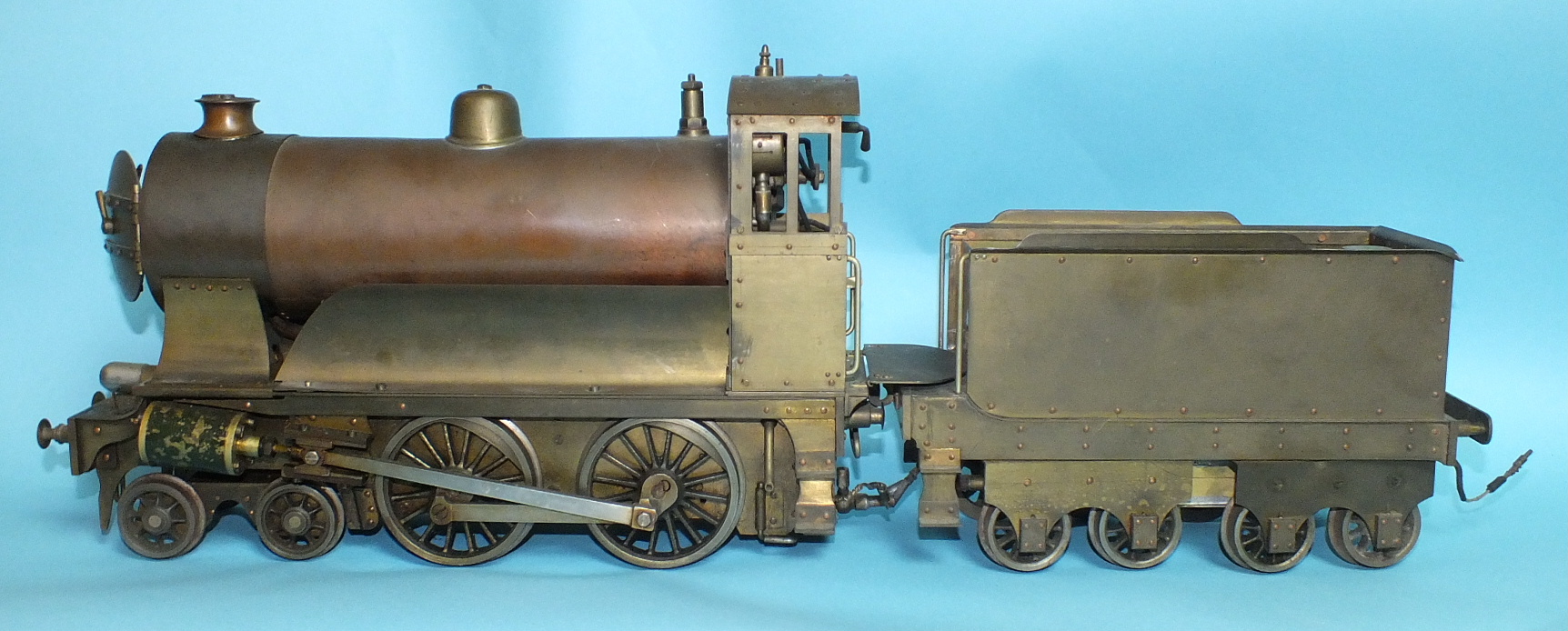 A scratch built live steam 3" gauge 4-4-0 locomotive and bogie tender, brass and copper,
