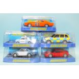 Five modern Scalextric cars by Hornby Hobbies Ltd, all in plastic boxes.