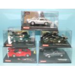 Five Carrera Evolution Scalextric style slot cars, including two James Bond 007 cars, all boxed.