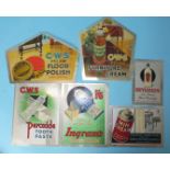 Six tin advertising signs including three CWS signs for polish and toothpaste, various sizes and