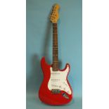 A replica electric Stratocaster guitar.