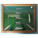 A framed display of eleven cut-throat razors, including "Ebor", "Es-Ex" and John Hall razors.