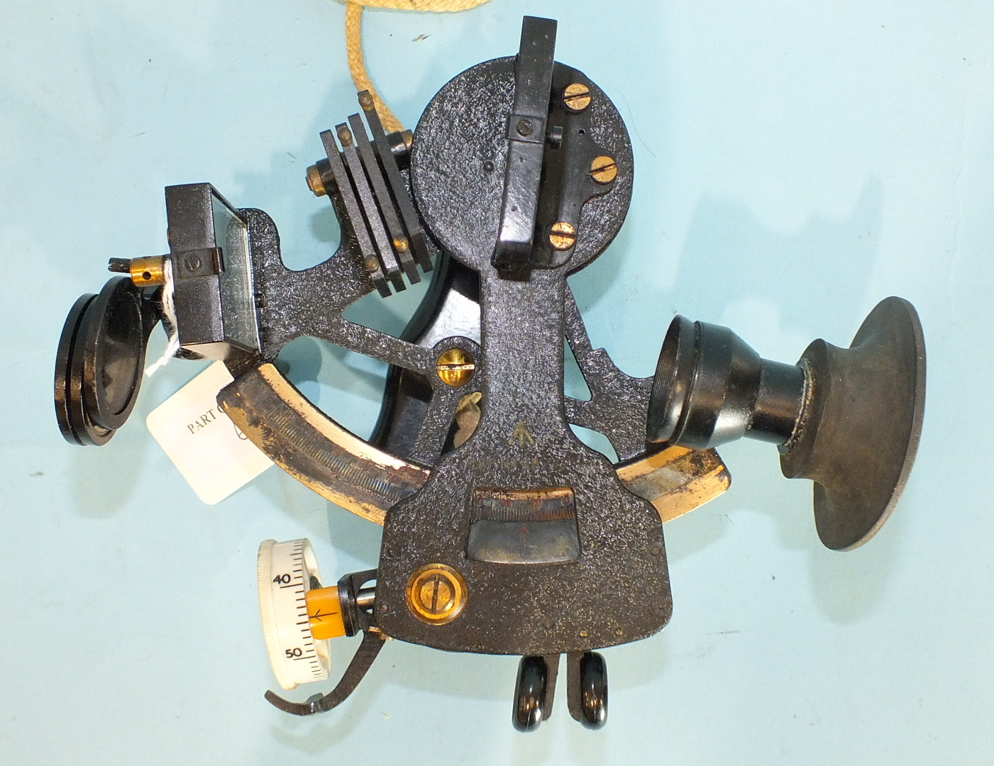 A 20th century bronze sextant finished black, with MOD arrow, Bakelite handle and seven shades, in