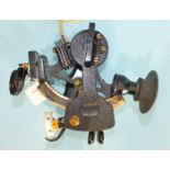 A 20th century bronze sextant finished black, with MOD arrow, Bakelite handle and seven shades, in