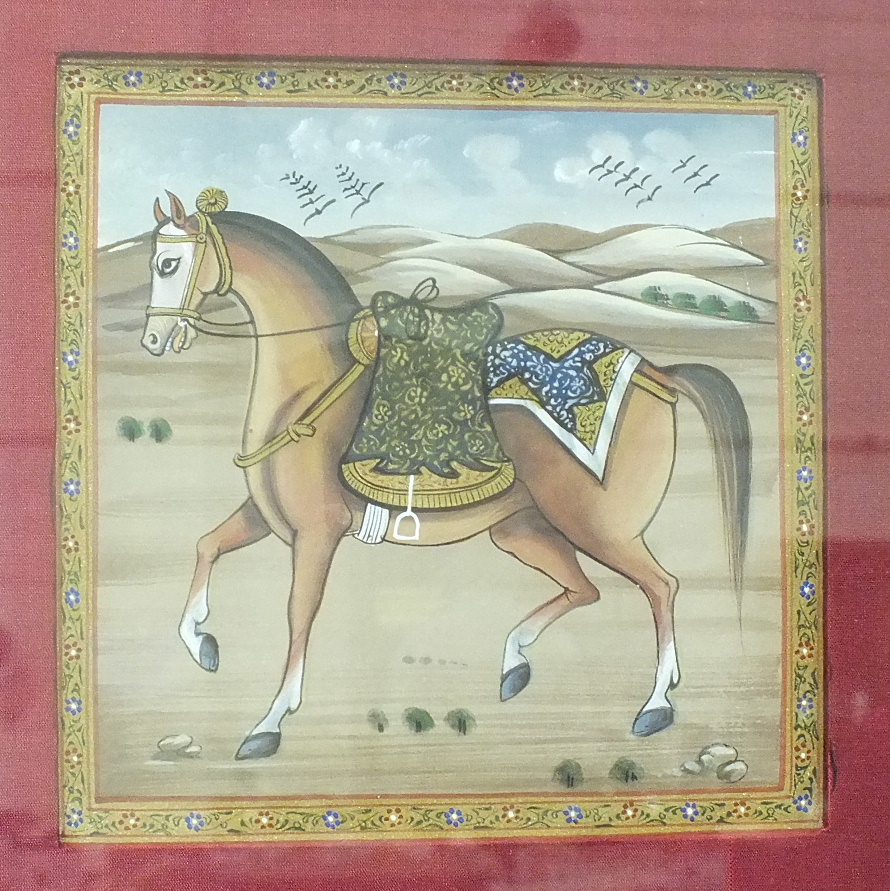 Two small Indian watercolour pictures of horses in a landscape within large silk-covered mounts,