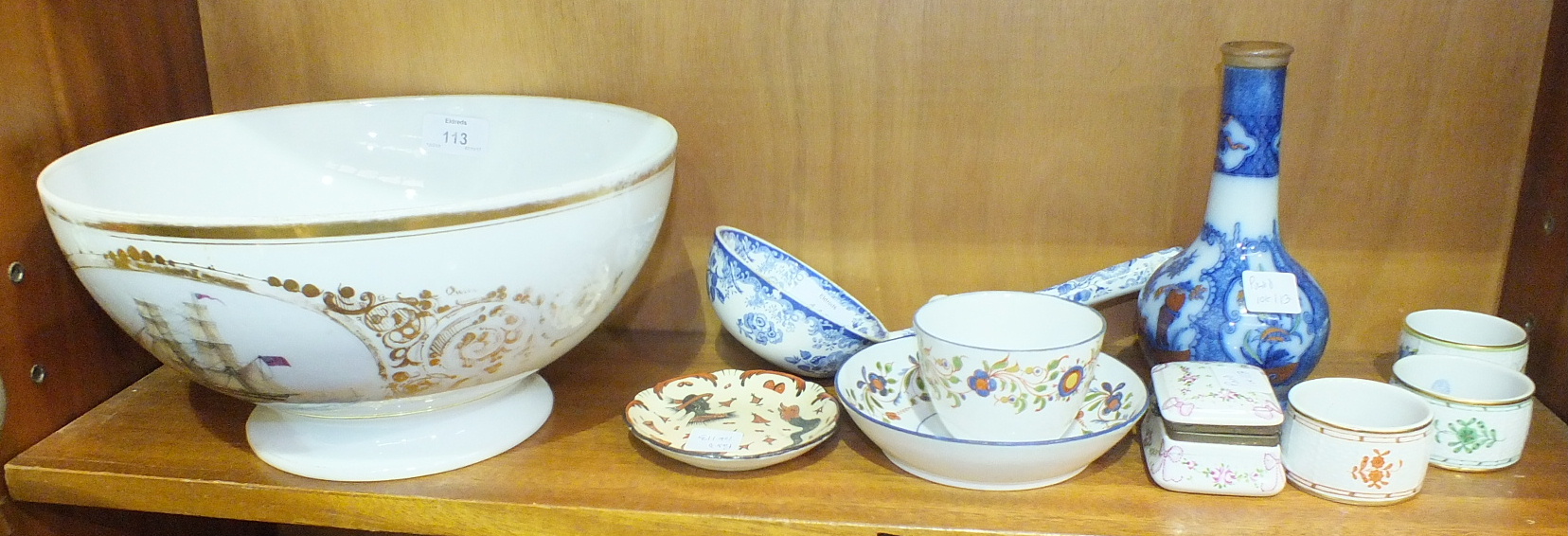 An English blue and white pattern soup ladle, a Continental ceramic trinket box and cover, 7cm wide,