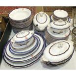 A large quantity of late-19th/early-20th century dinnerware decorated with blue and gilt borders,