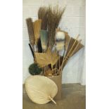 A large and unusual collection of brushes made from natural materials, including besoms, hard