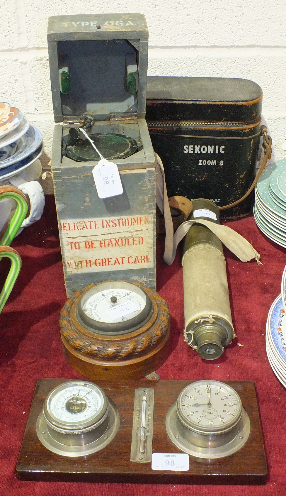 A Type 06 A military compass No. 19807D, in carrying box, a small circular metal aneroid