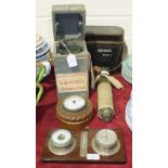 A Type 06 A military compass No. 19807D, in carrying box, a small circular metal aneroid