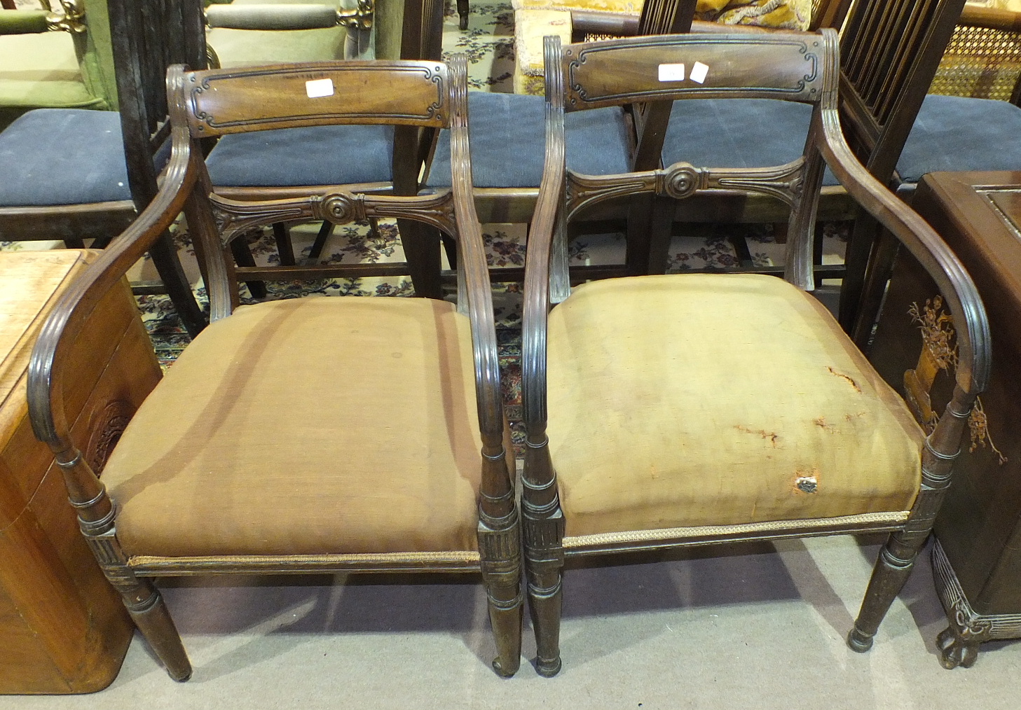 A pair of Georgian mahogany carver chairs with rail backs and moulded arms, on turned front legs, (