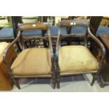 A pair of Georgian mahogany carver chairs with rail backs and moulded arms, on turned front legs, (