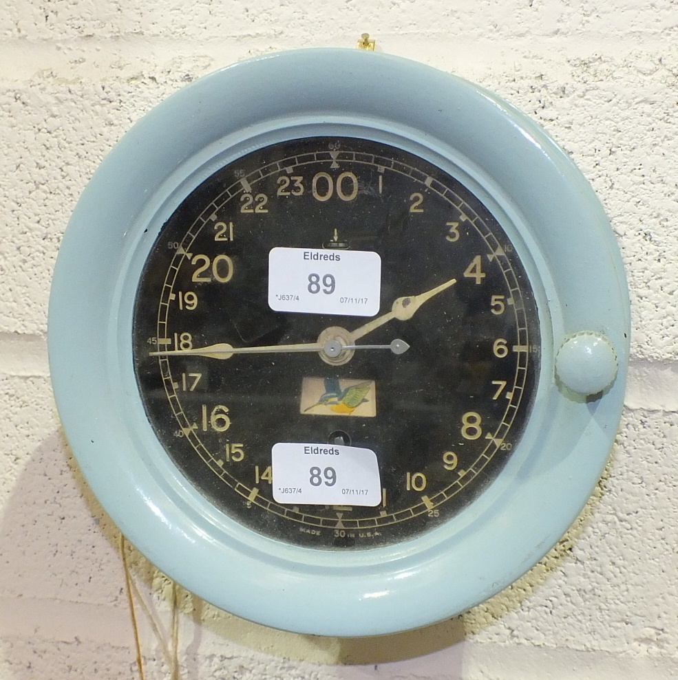 A Seth Thomas painted metal circular military-style time clock, the black dial and Arabian