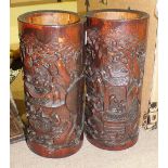 Two carved bamboo brush pots, 24cm high, a Chinese bamboo figural carving and other Oriental