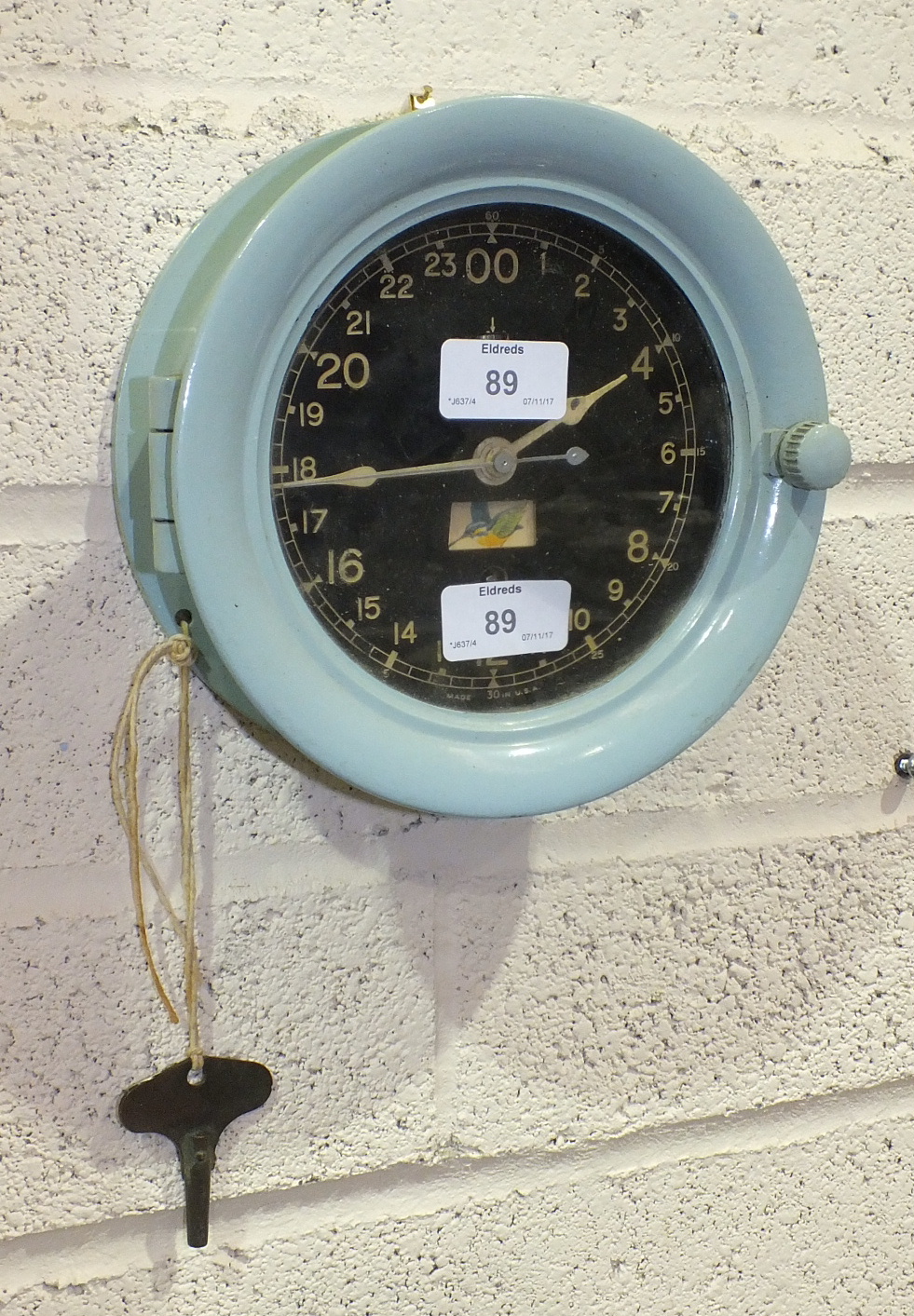 A Seth Thomas painted metal circular military-style time clock, the black dial and Arabian - Image 2 of 2