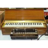 A Busilacchio electric keyboard, (legs lacking) and a 19th century Busson, Paris, Flutina accordion,