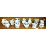 Twelve Royal Worcester porcelain jugs from the 'Historic Jugs' collection, tallest 9.5cm, (12).