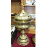 A pressed brass incense burner, 70cm high.