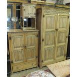 A 20th century limed oak bedroom suite, comprising: a two-door wardrobe, dressing chest, tallboy,