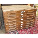 An early-20th century oak eight-drawer plan chest, 116cm, in two sections.