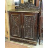 A 19th century Continental carved oak side cabinet, 92cm wide.