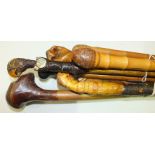 Two carved bamboo walking sticks and five others, (7).