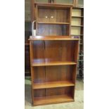A set of stained wood bookshelves, 67 x 184cm and a smaller bookcase, 86 x 130cm, (2).