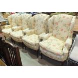 Four modern 'Duresta' floral-decorated wing armchairs raised on stained wood cabriole legs, (