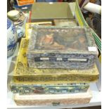 An olive wood games counter, a small collection of jigsaw puzzles and other items.