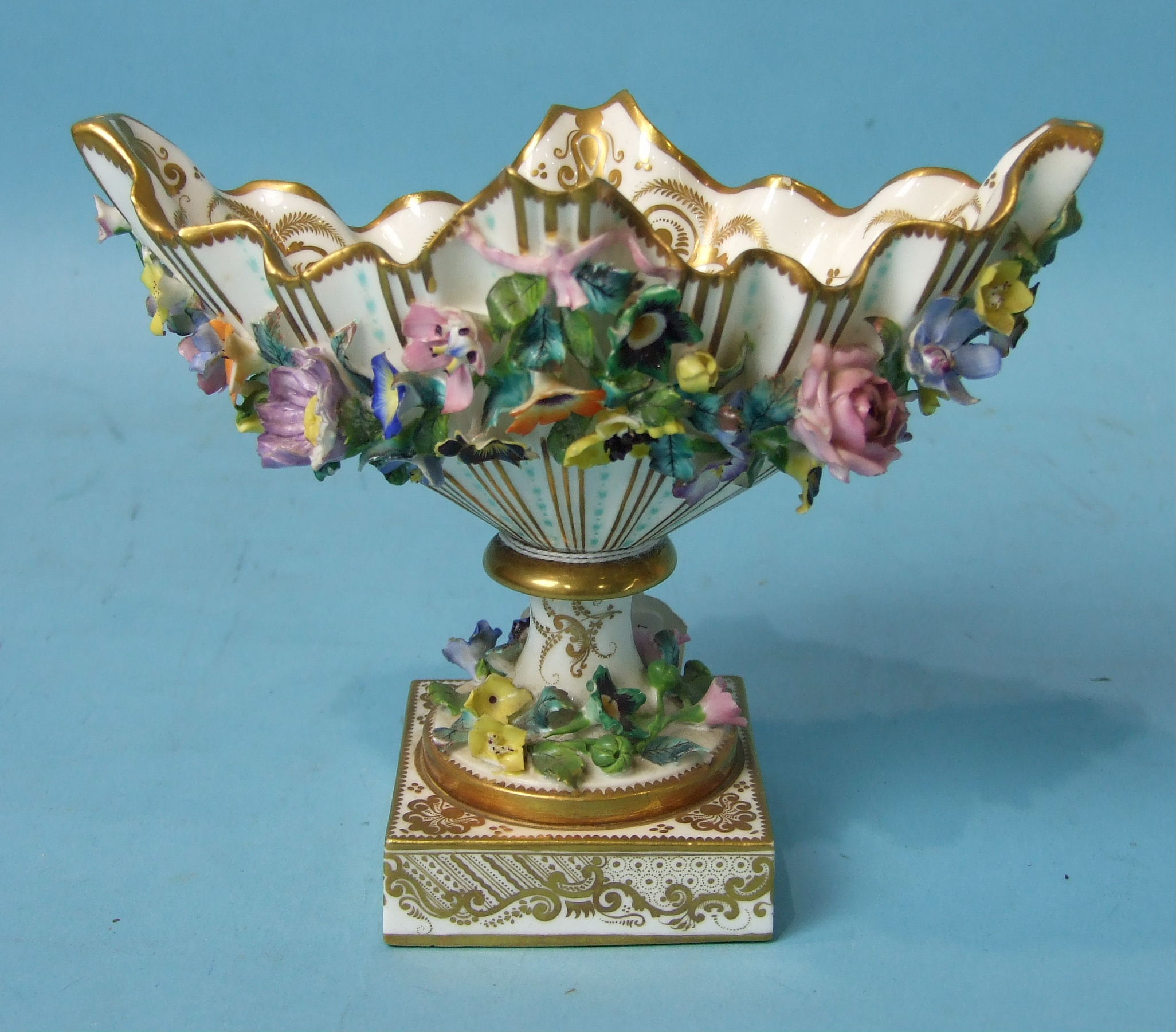 A mid-19th century Minton porcelain boat-shaped vase on square base encrusted with flowers, fine