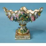 A mid-19th century Minton porcelain boat-shaped vase on square base encrusted with flowers, fine