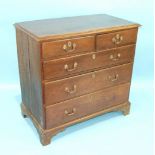 An antique oak chest of two short and three long moulded drawers, on bracket feet, 98cm wide, 94cm