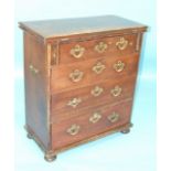 An antique mahogany bachelor's chest, the fold-over top above four long drawers, on bun feet, 76cm