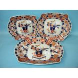 A graduated set of three Japanese Imari shaped oval dishes, largest 40cm long.