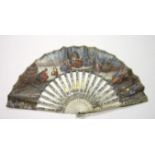 An 18th century ivory and paper fan, the guards and sticks pierced and carved, overlaid in silver