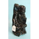 A 19th century Chinese hardwood figure of a seated Buddha, 24cm high.