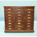 A late-19th century hardwood file cabinet 'Amberg's Patent Cabinet Letter File', the rectangular top