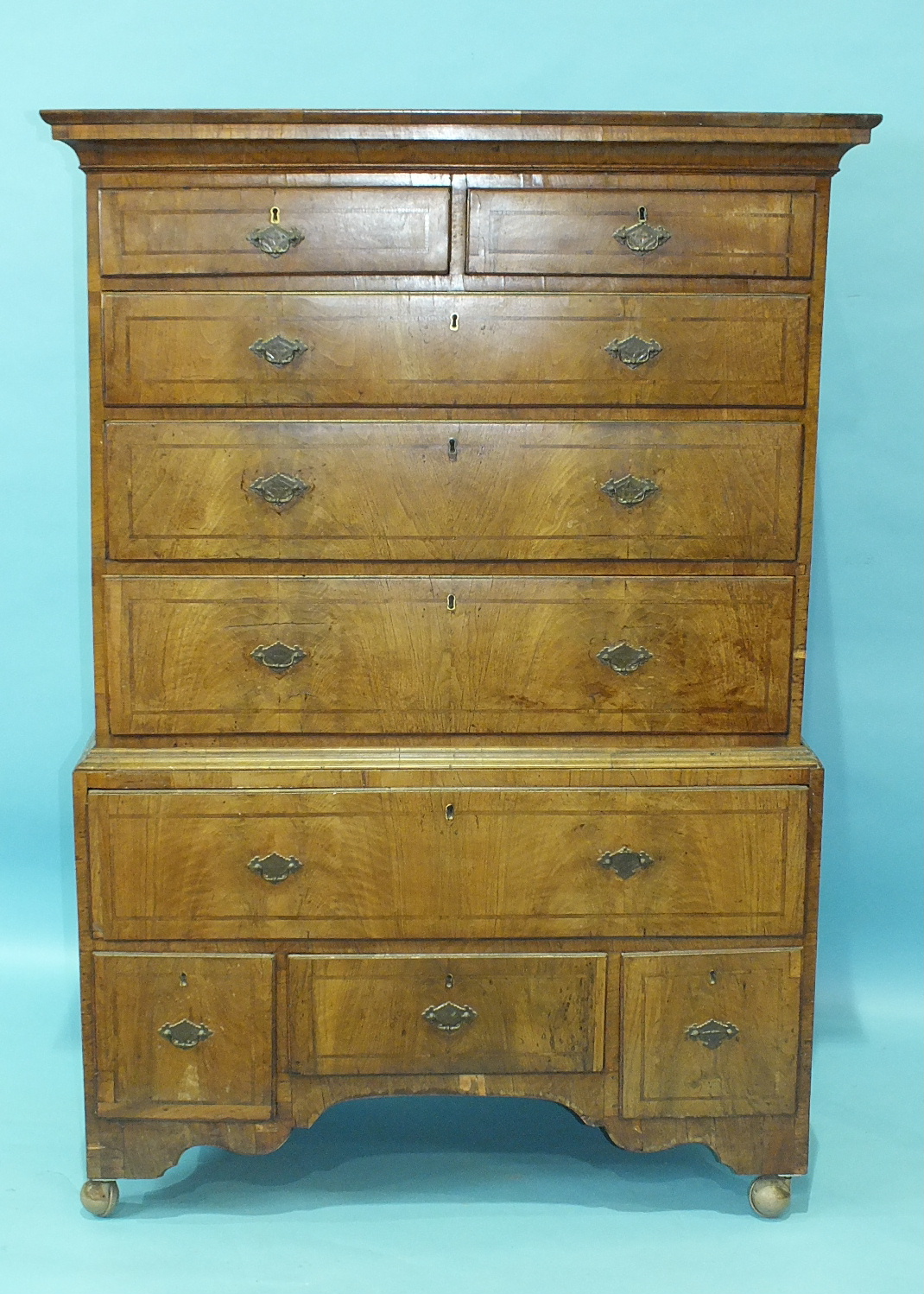 An 18th century walnut chest on stand, the moulded cornice above two short and three long drawers, - Image 2 of 2