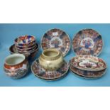 A set of six Japanese Imari shaped-rim plates, 21cm diameter, a similar oval dish, six similar bowls