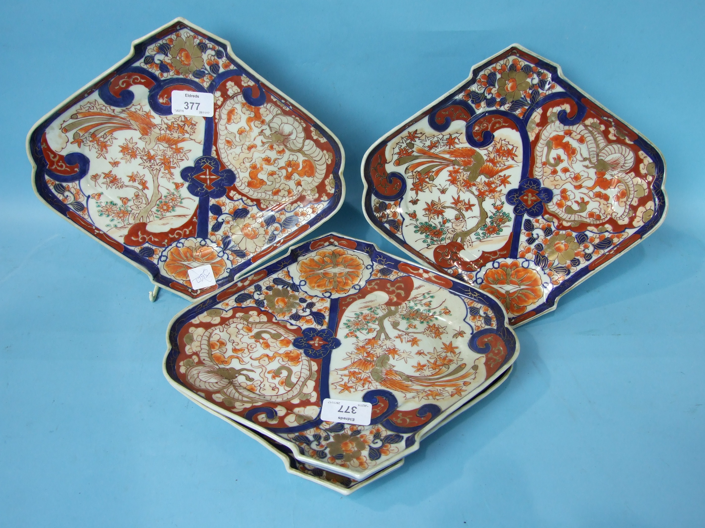 A set of four Japanese Imari shaped fan dishes, 29cm.