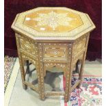 An Indian hardwood bone and ebony inlaid octagonal table top and folding stand, 50cm wide, bearing