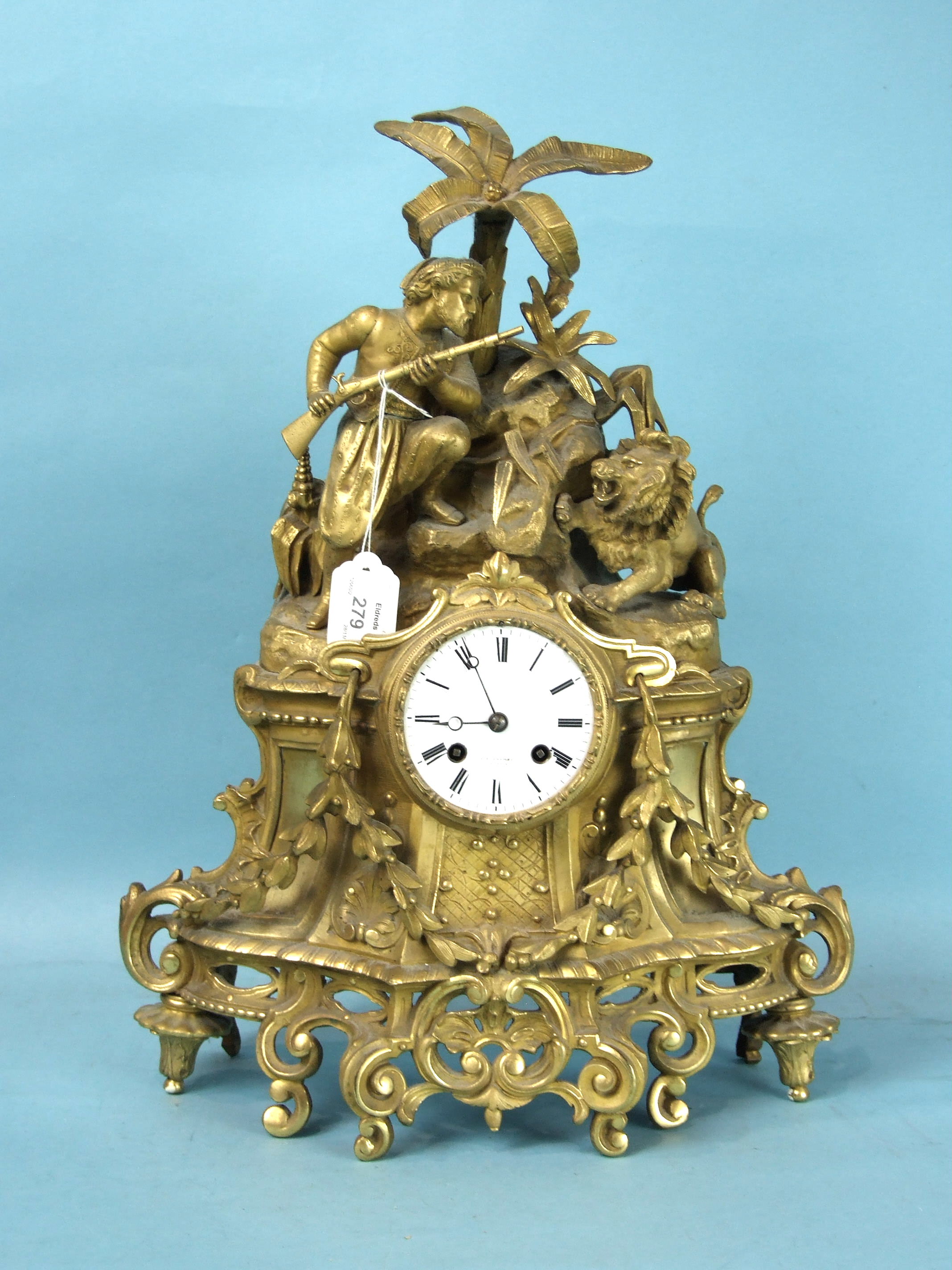 C F Crewes À Paris, a 19th century gilt metal mantel clock, the case surmounted by a lion and