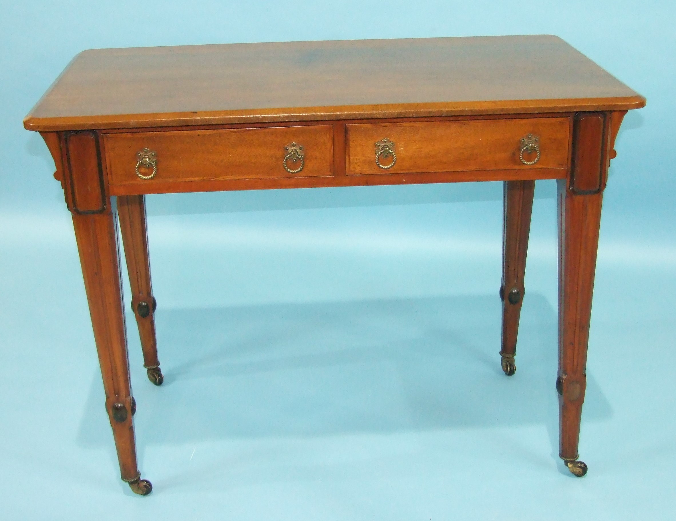 An early-20th century walnut side table, the rectangular top above two frieze drawers, on square