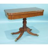 An early-19th century mahogany rectangular tea table, the fold-over top on turned column and four