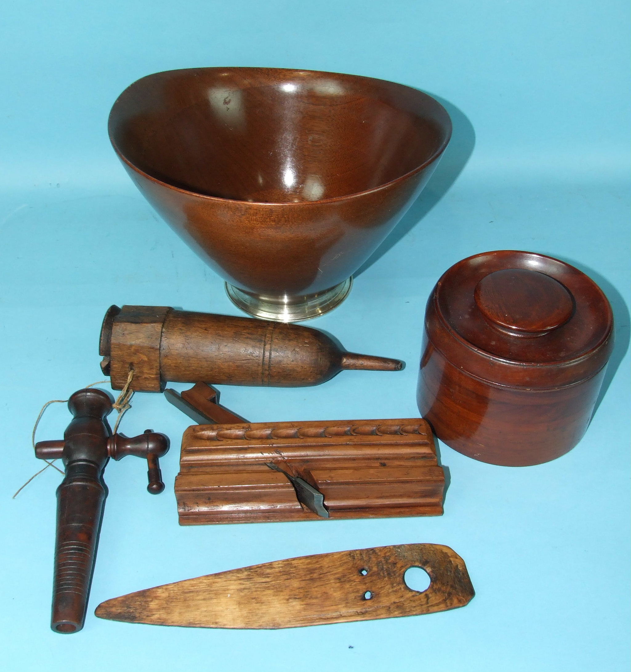 A mahogany tapered and shaped bowl on white metal foot, stamped 'Sterling', 21cm high, 30cm