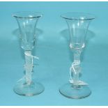 Two 19th century Continental ale glasses, each with flared bowl and knopped opaque twist stem, on