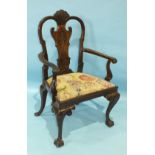 A large Chippendale-style mahogany armchair, the carved vase splat surmounted by shell carving,